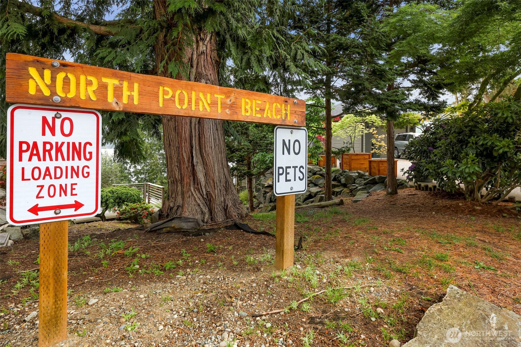 20 North Point Drive Bellingham, WA 98229 - Photo 8 of 16 a view of a street sign under a large tree