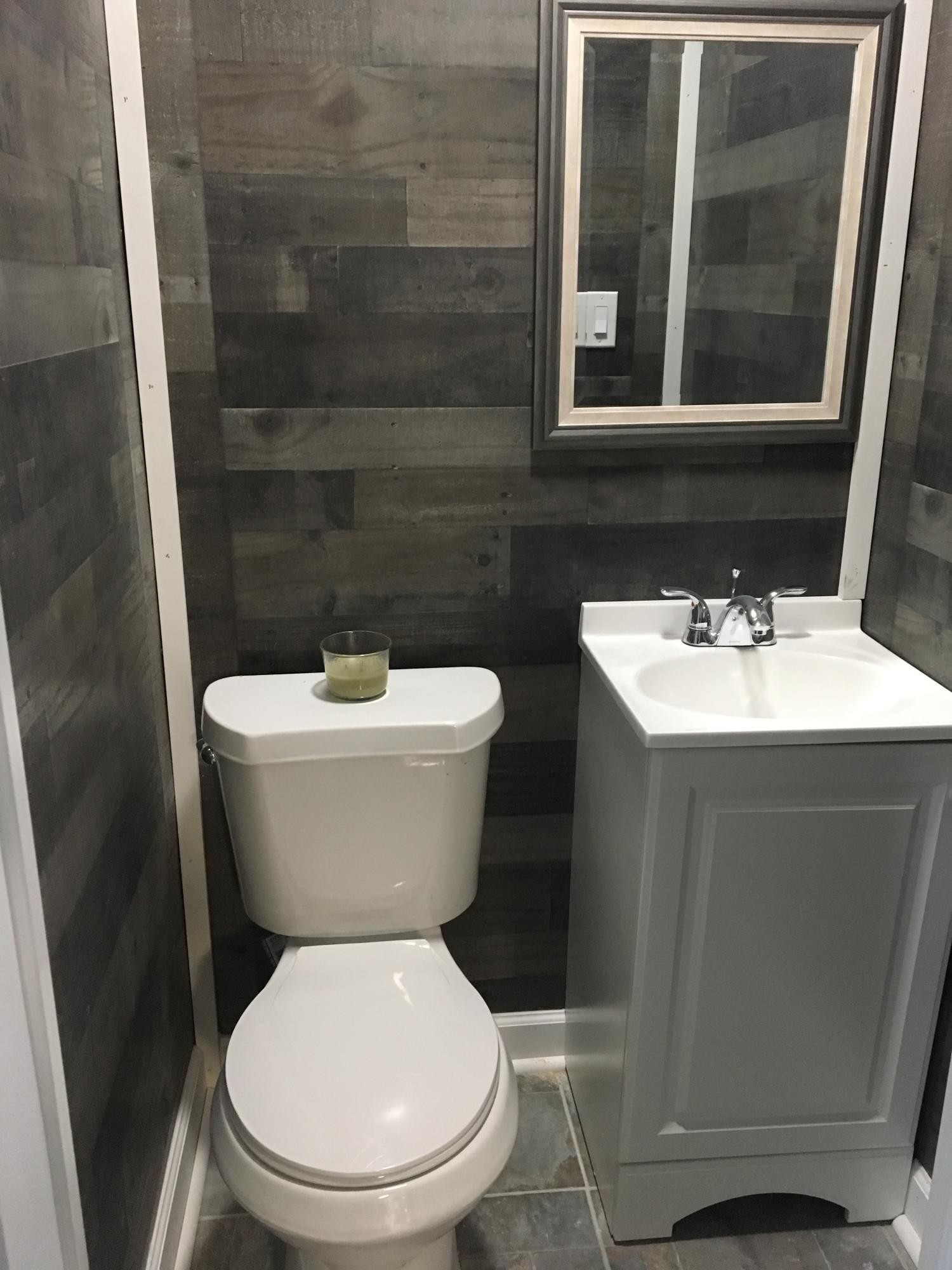 107 Pembroke Road Oak Ridge, TN 37830 - Photo 22 of 28 a white toilet sitting next to a bathroom sink