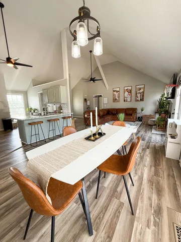 a view of a dining room with furniture and wooden floor
