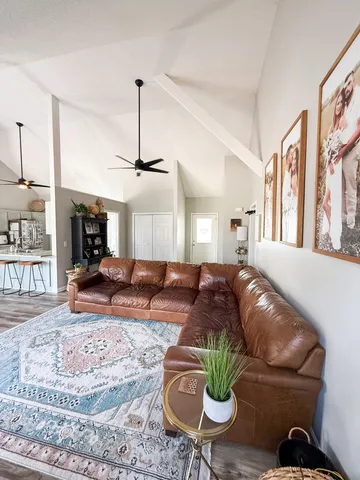 a living room with furniture and a fireplace