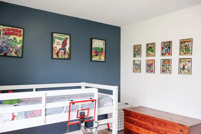 a bedroom with a workspace