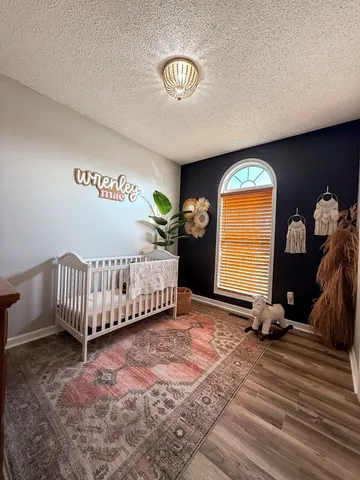 a spacious bedroom with a bed and a couch