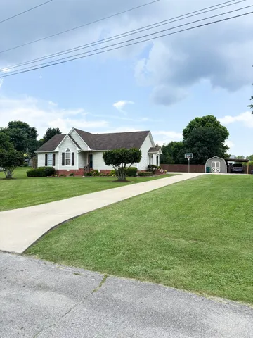 a house view with garden space