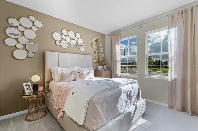 a bedroom with a large bed and a window