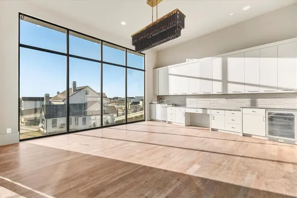 a view of balcony with floor to ceiling window and outdoor seating