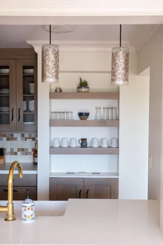 a view of a dining room with furniture and window