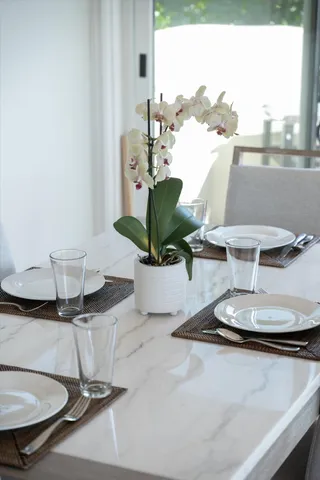 a bedroom with a bed and a balcony view