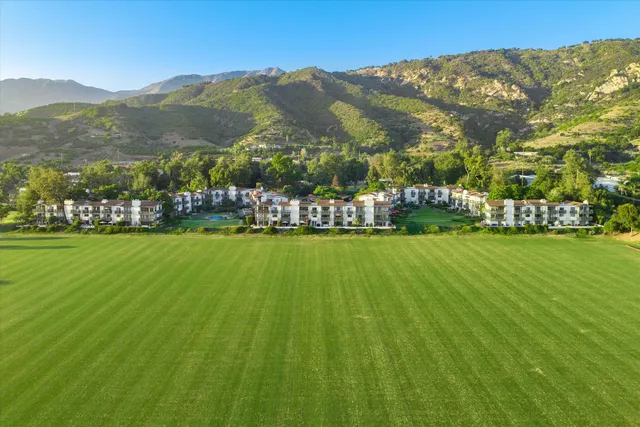 an aerial view of a house with a lake view