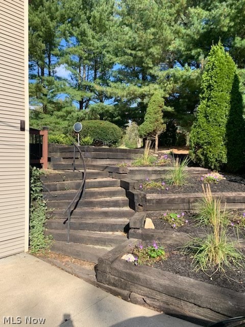 6436 Neff Road Valley City, OH 44280 - Photo 27 of 35 Steps and garden beds from garage to front door