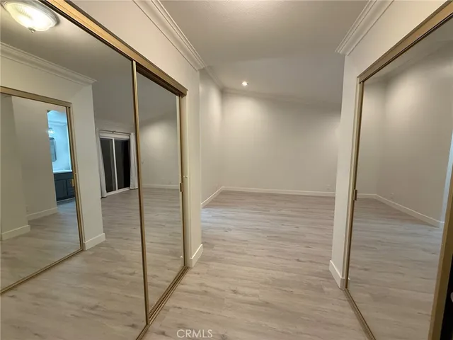 a view of hallway with wooden floor