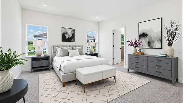 a bedroom with a bed and a couch