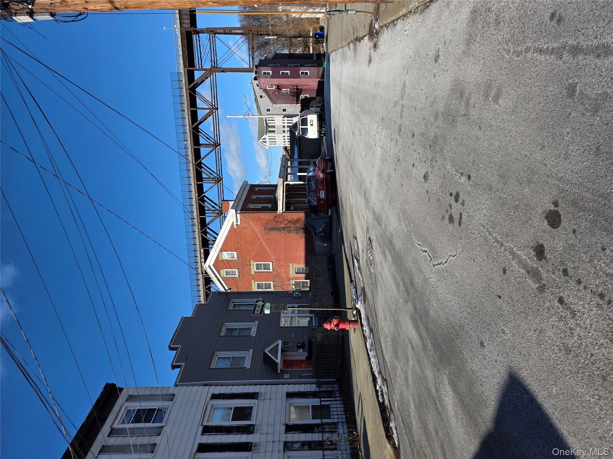 18 Davis Street Poughkeepsie, NY 12601 - Photo 13 of 14 View of asphalt road with curbs and sidewalks