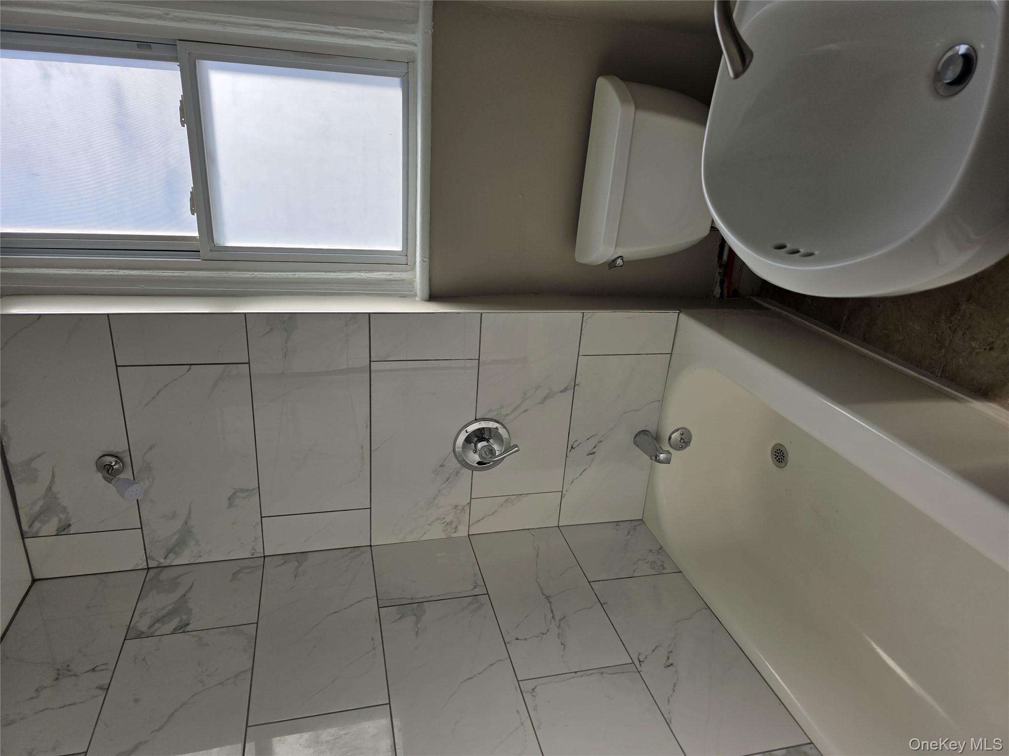 18 Davis Street Poughkeepsie, NY 12601 - Photo 8 of 14 Bathroom with a sink and shower combination