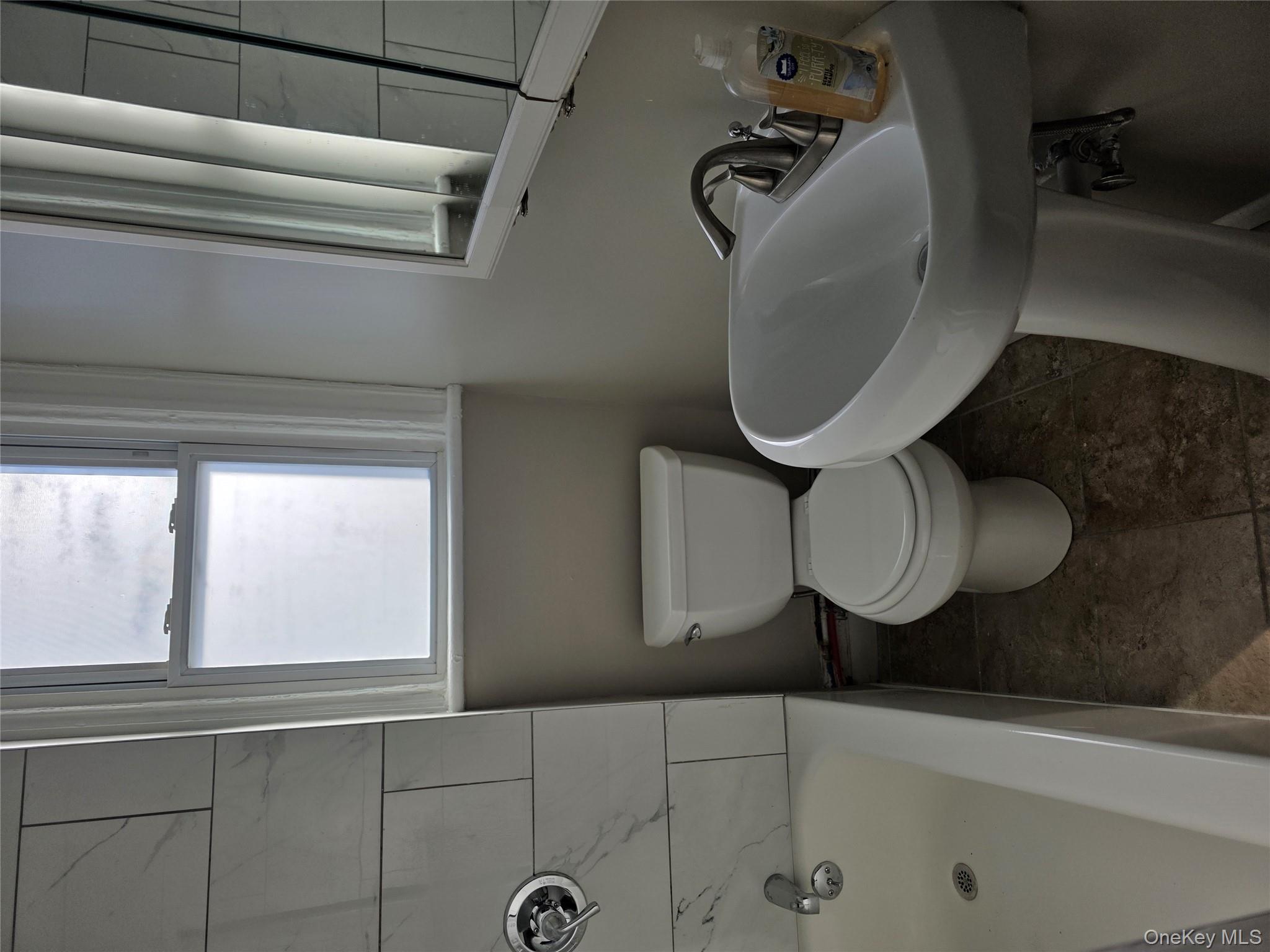 18 Davis Street Poughkeepsie, NY 12601 - Photo 9 of 14 Full bath with toilet and shower / bathtub combination