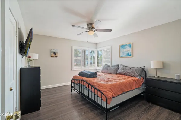 a kitchen with stainless steel appliances kitchen island granite countertop a refrigerator and a sink