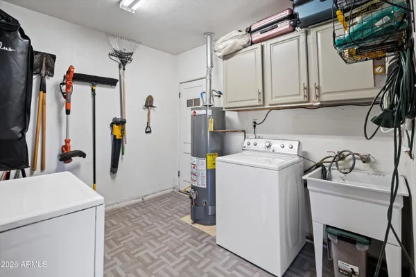 a bed room with a bed mirror and a window