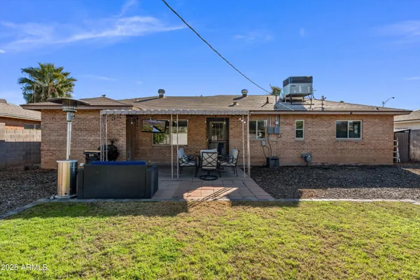 a view of a swimming pool with an outdoor seating