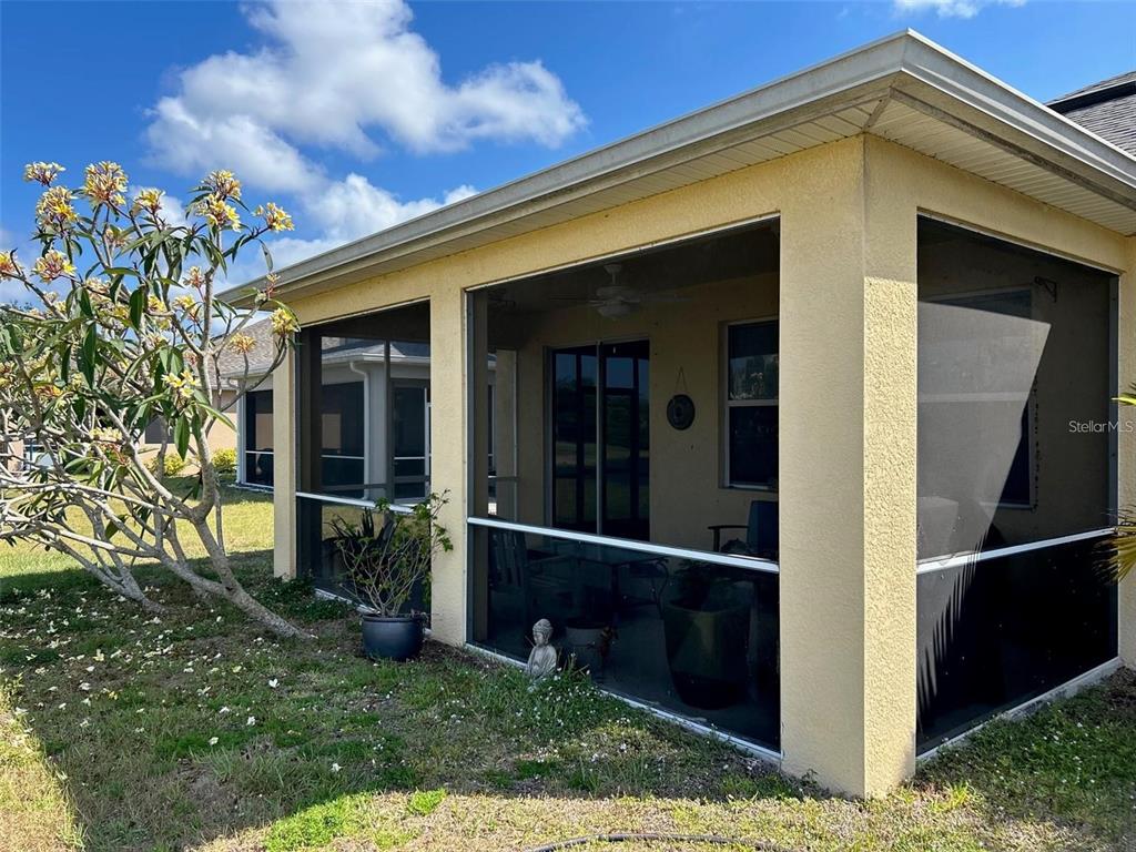 9996 Spring Gulch Lane Punta Gorda, FL 33950 - Photo 13 of 13 a view of a house with a small yard