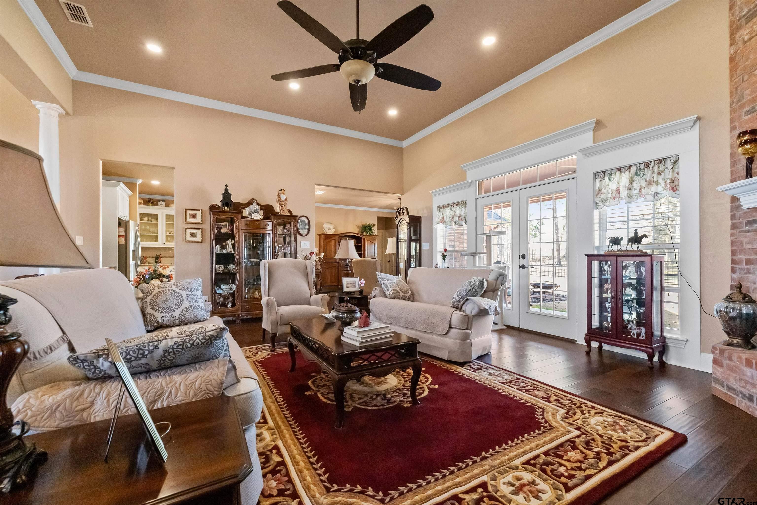 8499 Fm 856 Street Troup, TX 75789 - Photo 14 of 47 a living room with furniture and a wooden floor