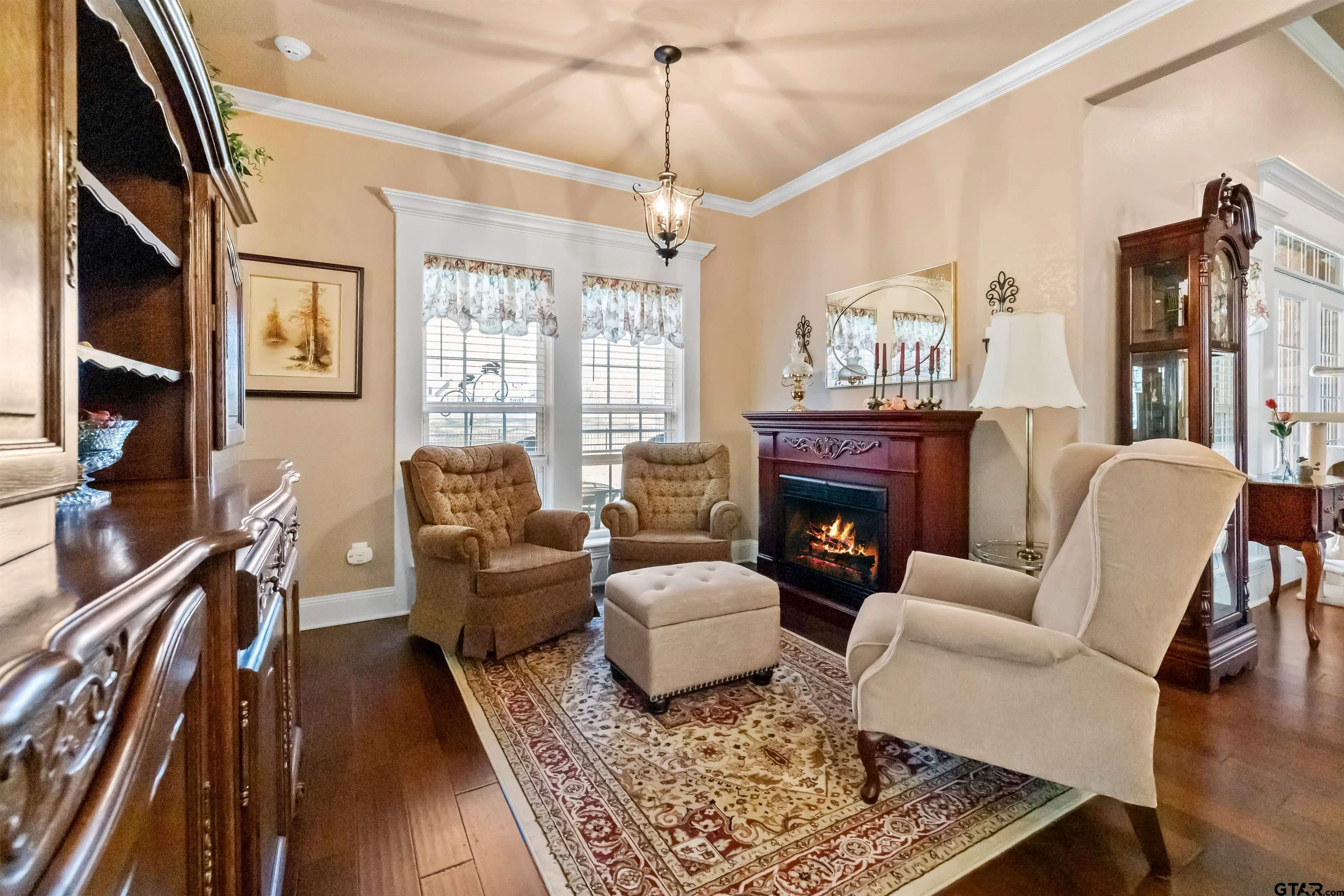 8499 Fm 856 Street Troup, TX 75789 - Photo 15 of 47 a living room with furniture and a fireplace