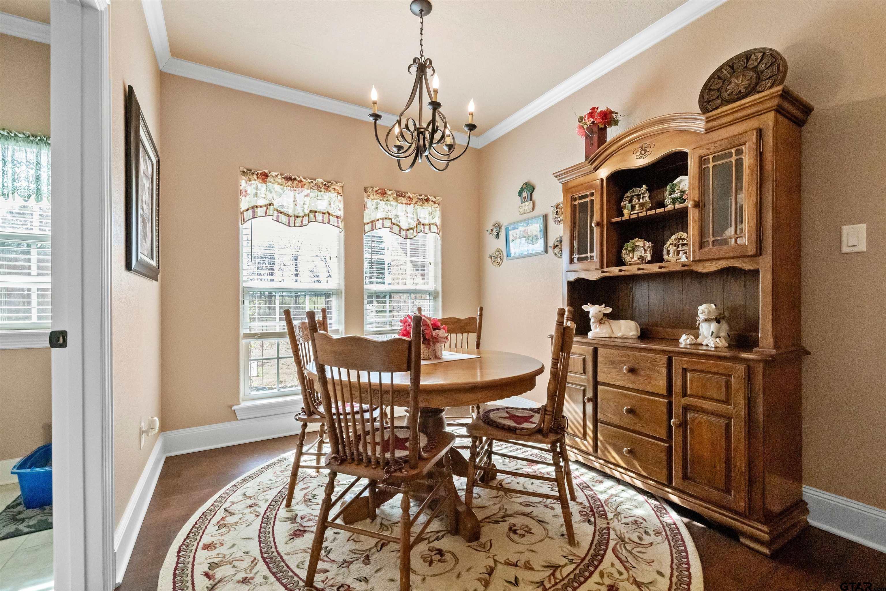8499 Fm 856 Street Troup, TX 75789 - Photo 20 of 47 a view of a dining room with furniture window and wooden floor
