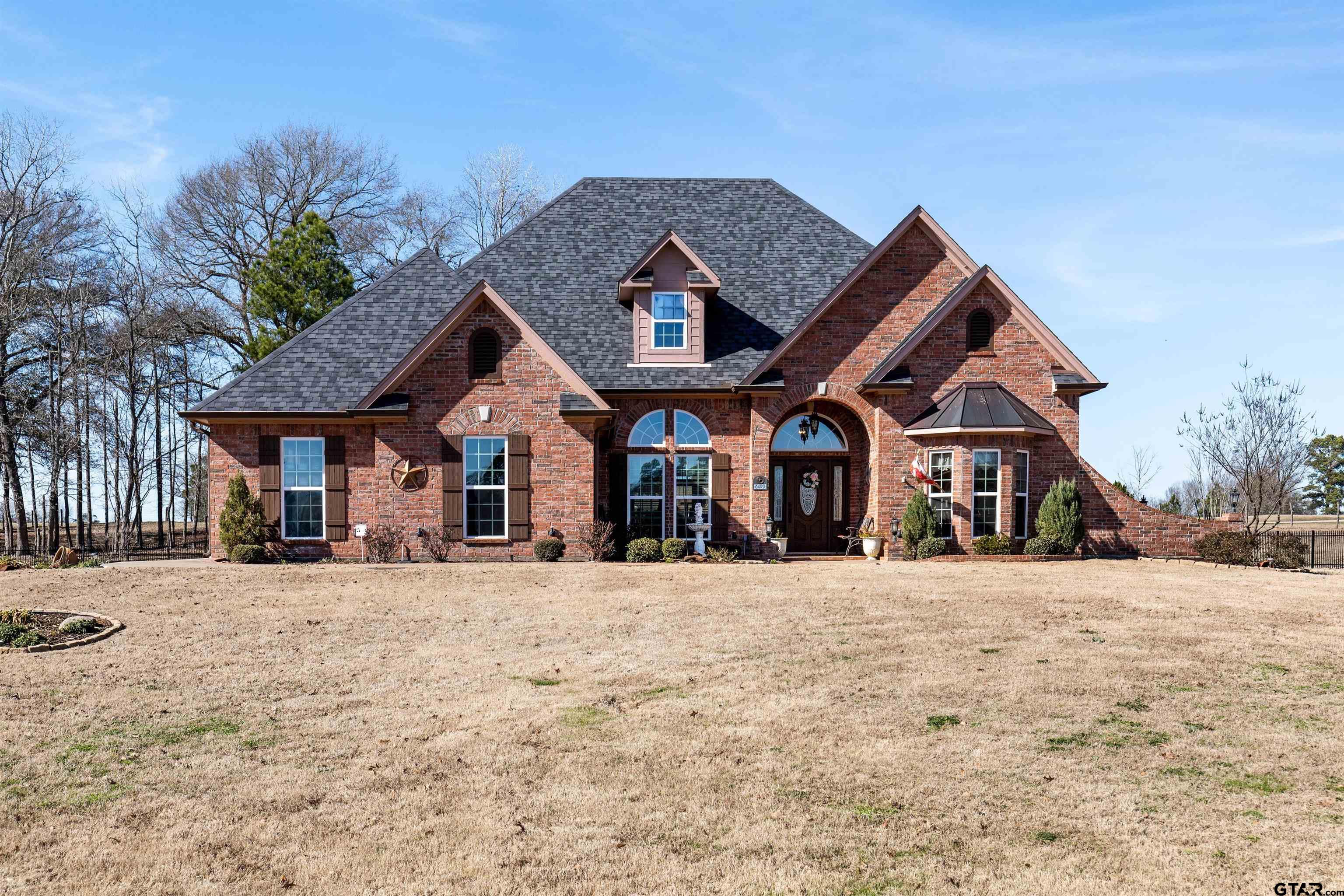 8499 Fm 856 Street Troup, TX 75789 - Photo 2 of 47 a front view of a house with a yard