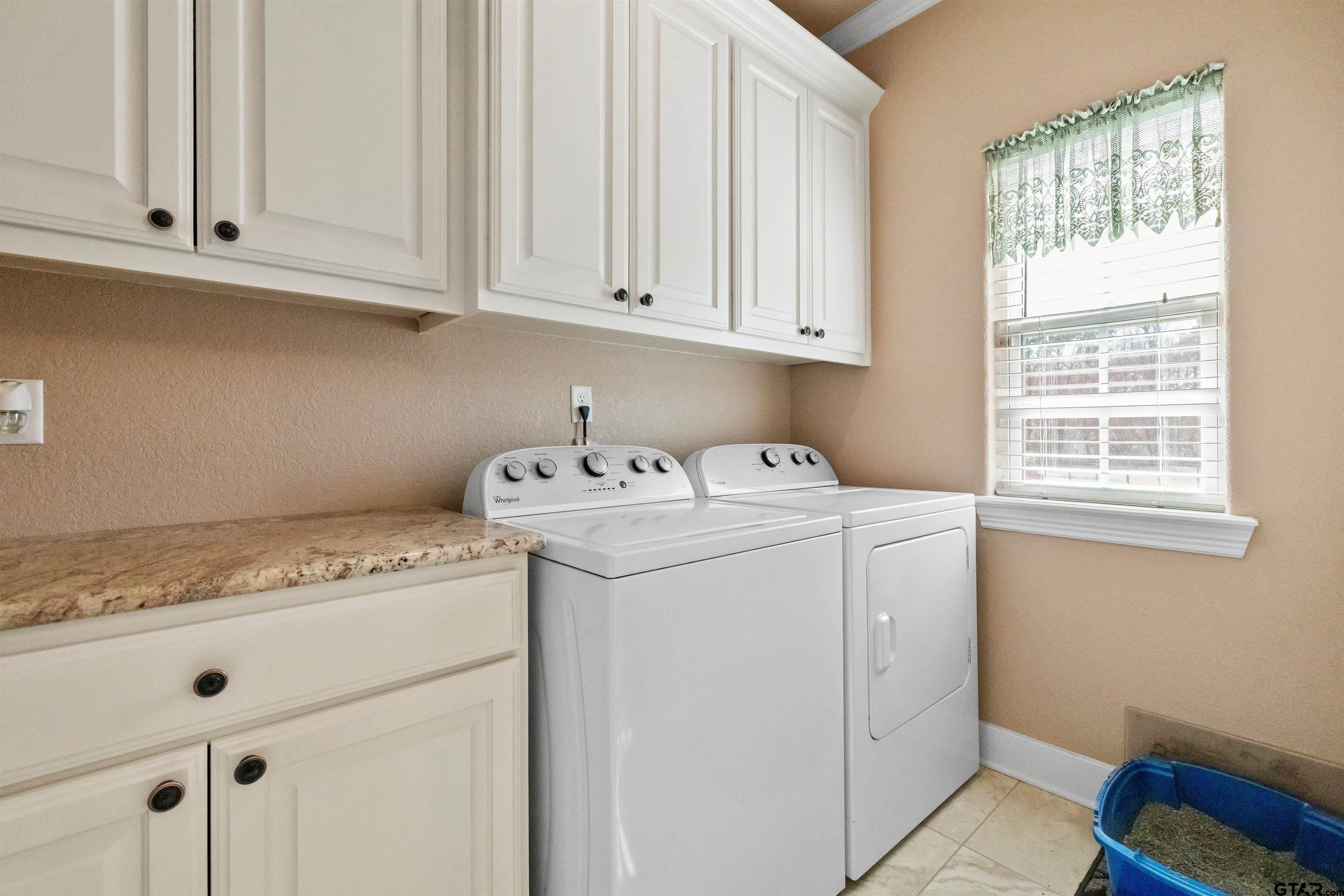 8499 Fm 856 Street Troup, TX 75789 - Photo 31 of 47 a utility room with dryer and washer