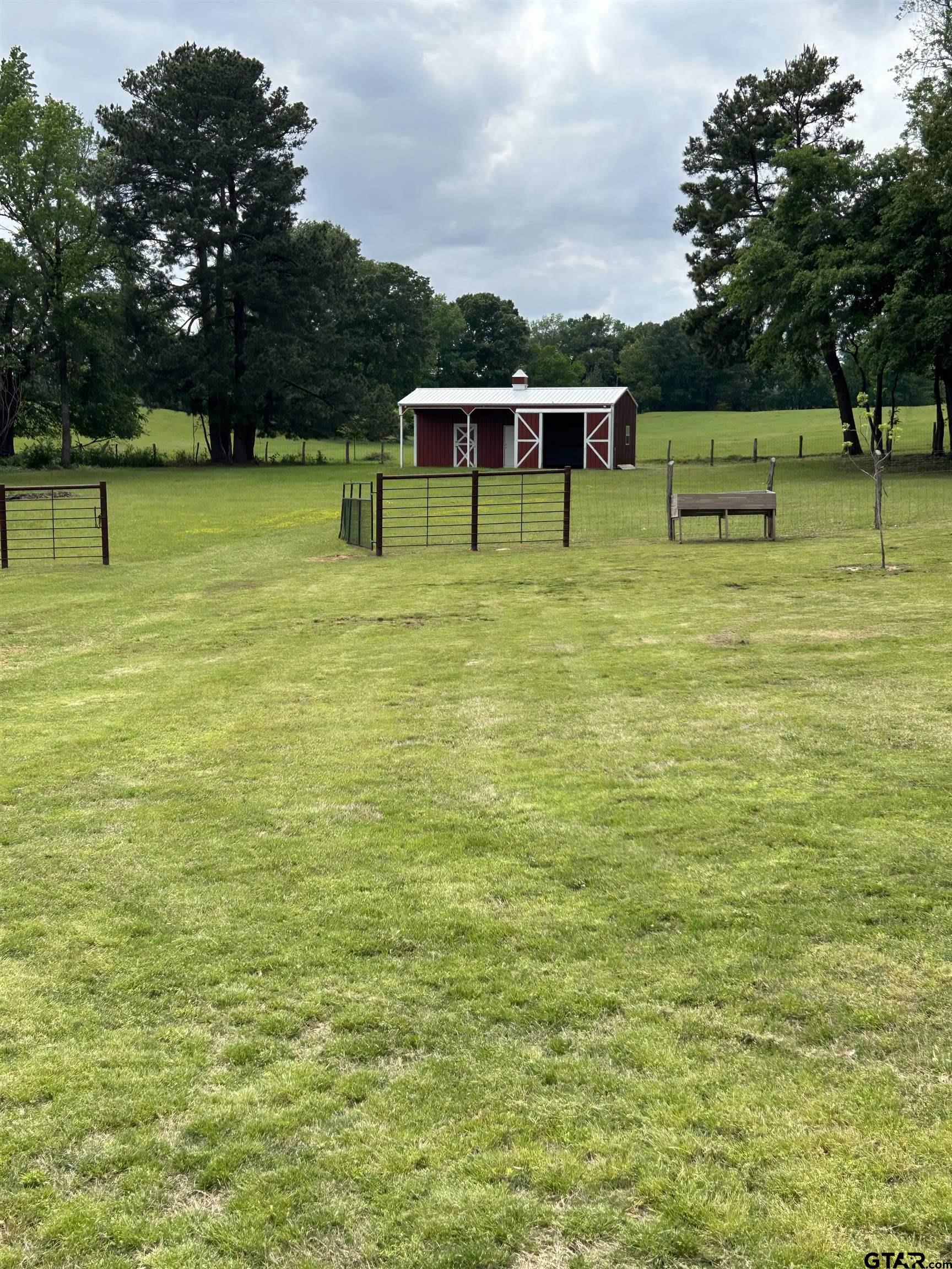 8499 Fm 856 Street Troup, TX 75789 - Photo 32 of 47 a view of a park with large trees