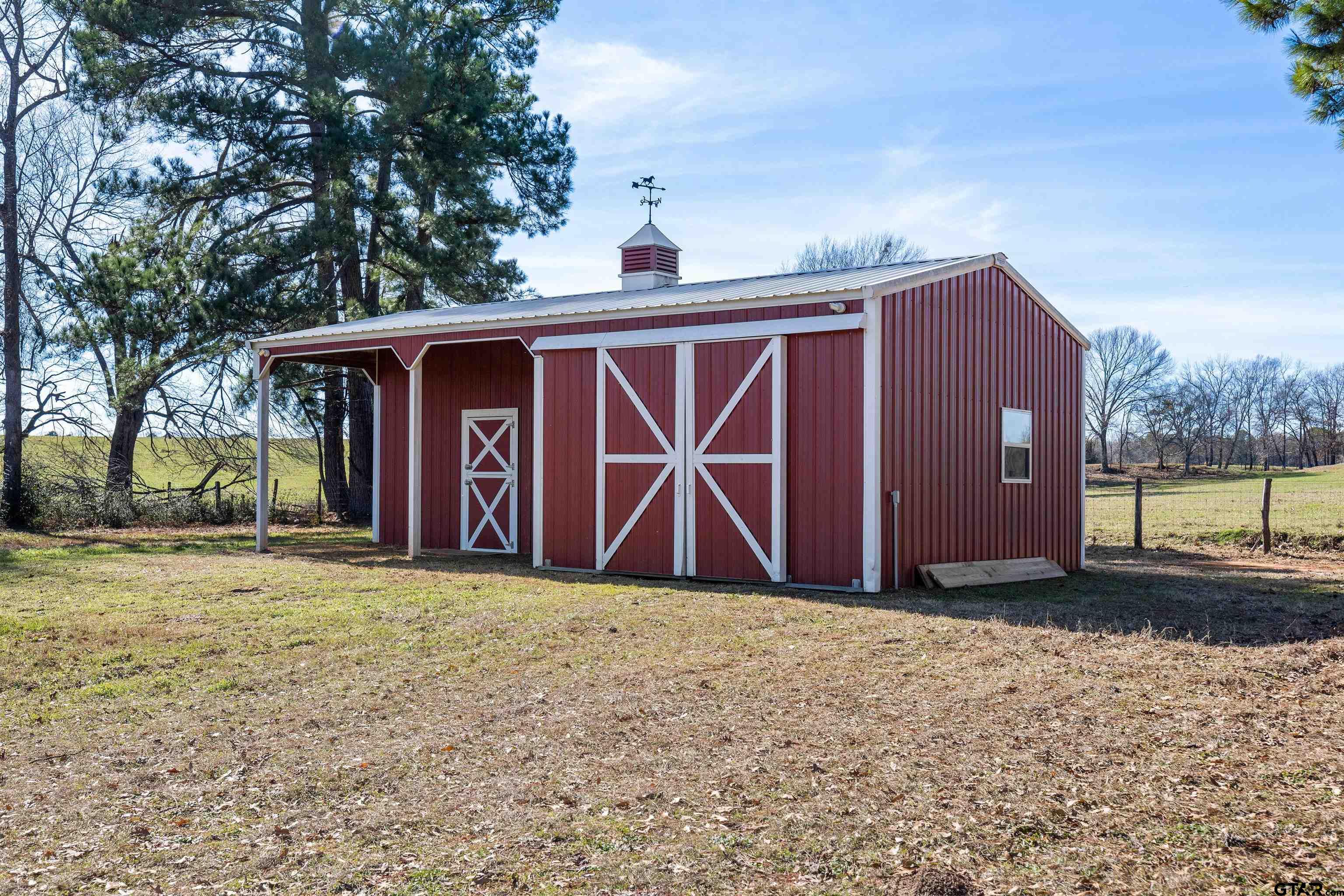 8499 Fm 856 Street Troup, TX 75789 - Photo 34 of 47 a front view of a house with a yard