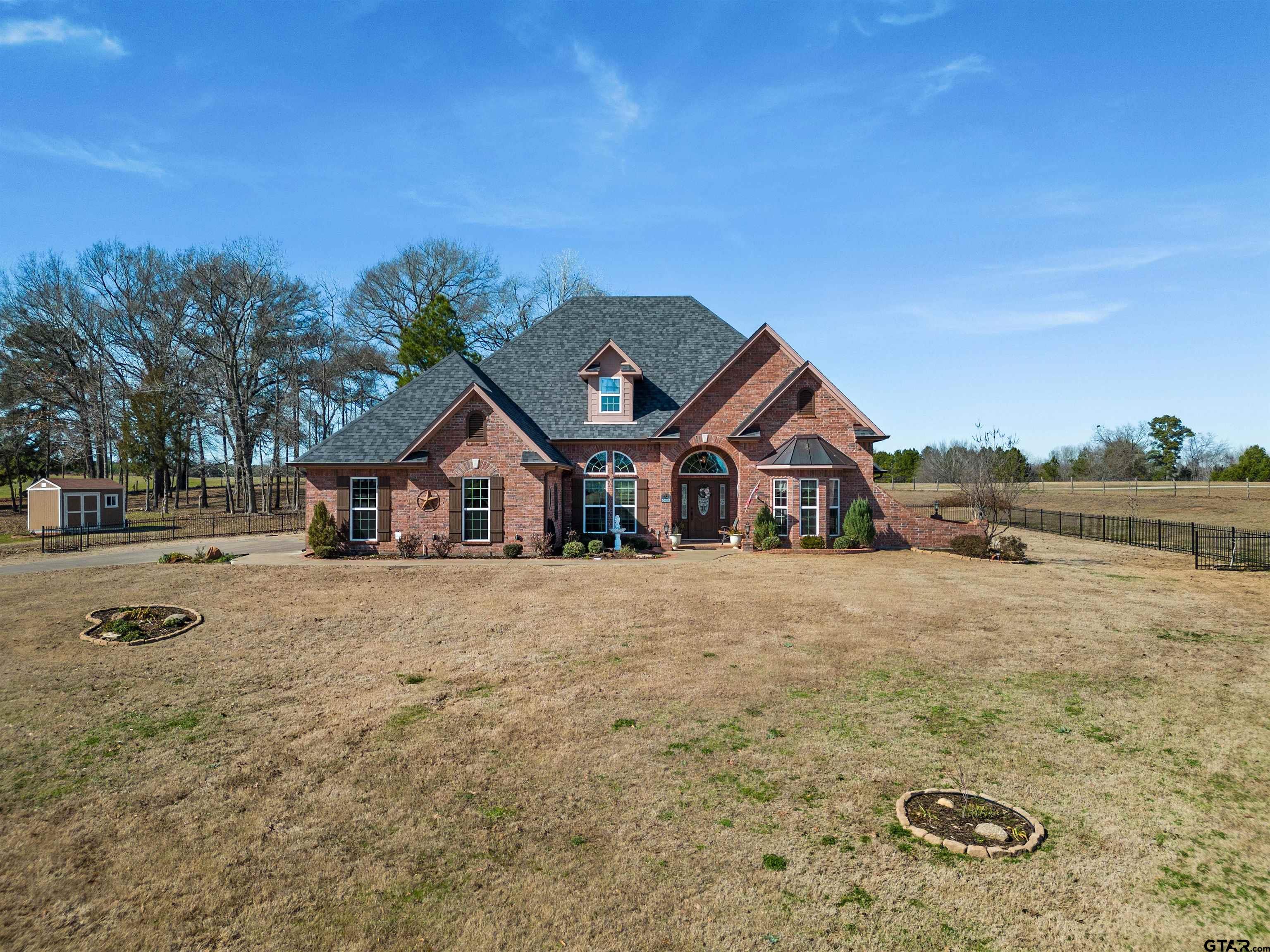 8499 Fm 856 Street Troup, TX 75789 - Photo 42 of 47 a house with trees in the background
