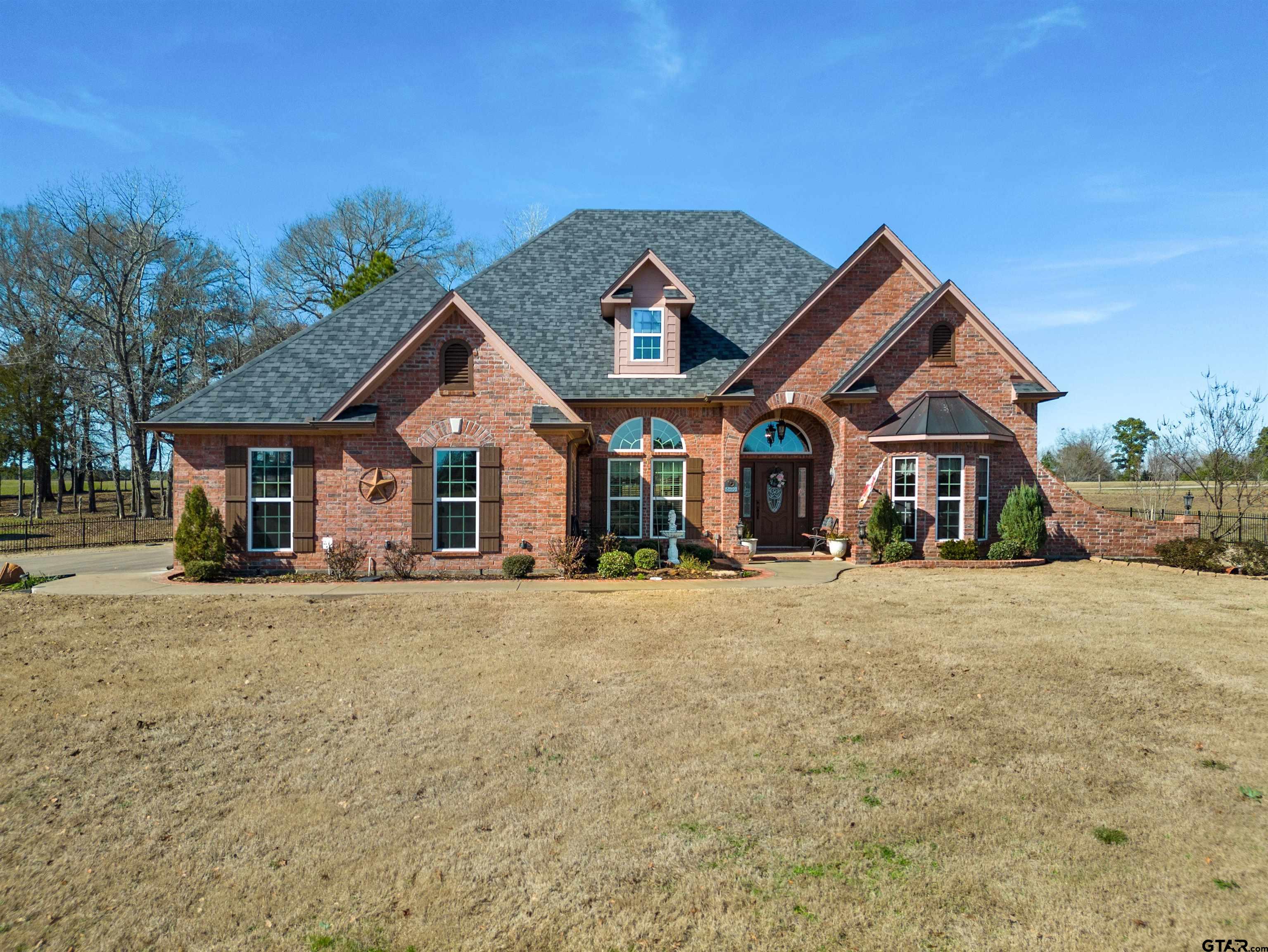 8499 Fm 856 Street Troup, TX 75789 - Photo 43 of 47 a front view of a house with a yard