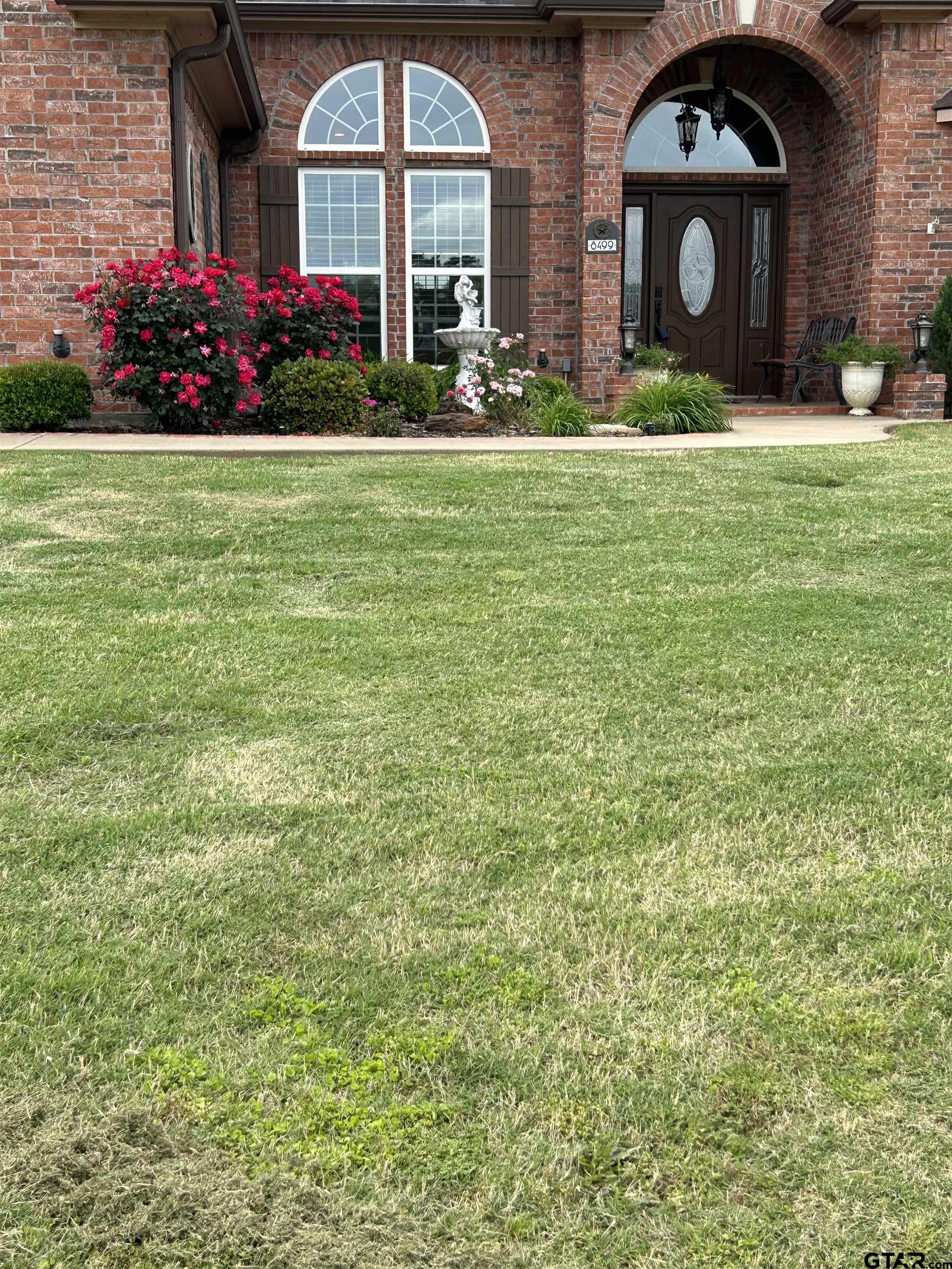 8499 Fm 856 Street Troup, TX 75789 - Photo 8 of 47 a front view of house with yard and outdoor seating