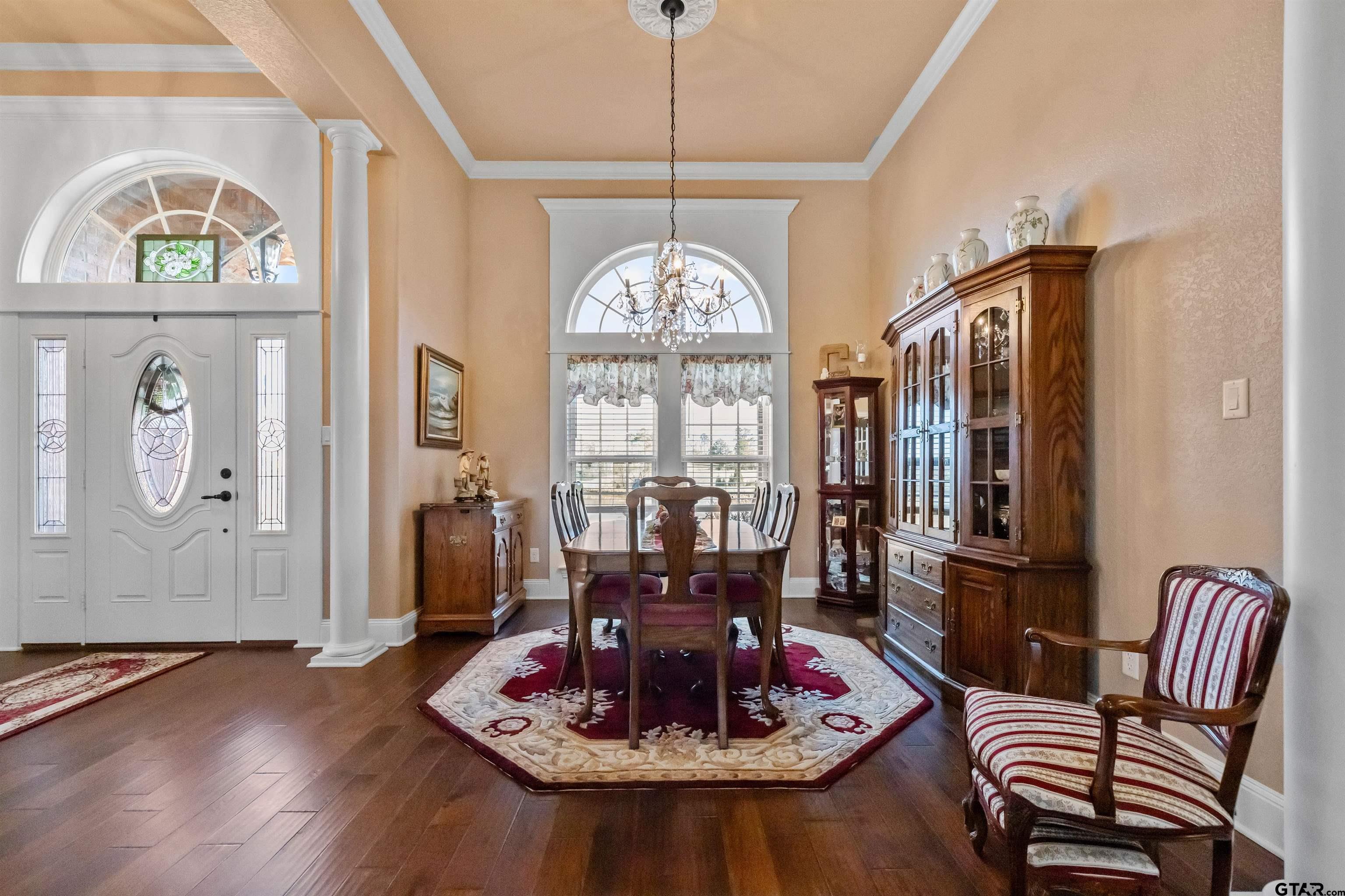 8499 Fm 856 Street Troup, TX 75789 - Photo 10 of 47 a view of a dining room with furniture a chandelier and wooden floor