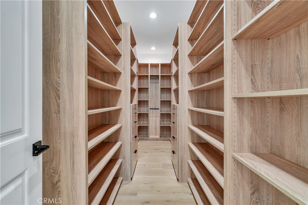 13838 Milbank Street Sherman Oaks, CA 91423 - Photo 21 of 57 a view of walk in closet with empty racks