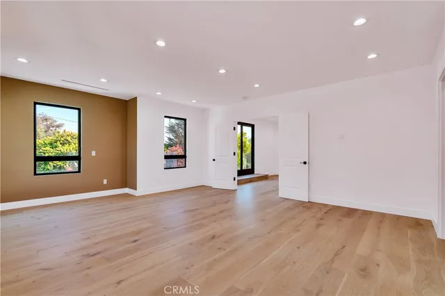 a view of a bathroom with a sink and mirror