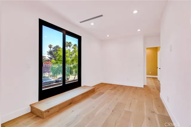 a view of a big room with windows and cabinet