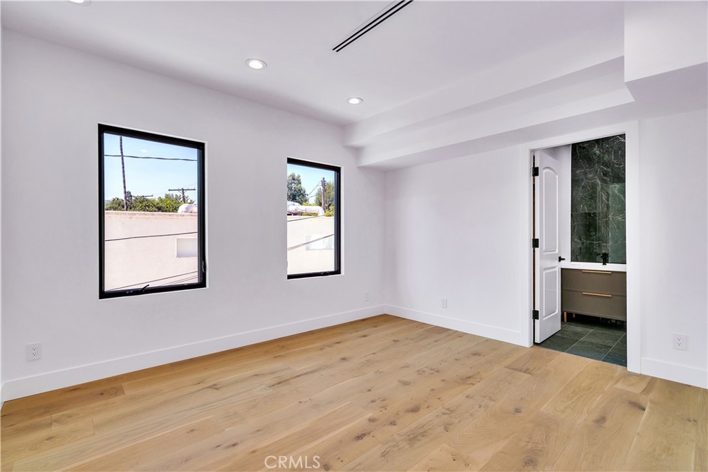 13838 Milbank Street Sherman Oaks, CA 91423 - Photo 27 of 57 a view of a big room with windows and cabinet