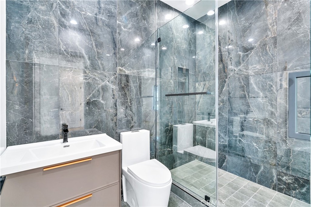 13838 Milbank Street Sherman Oaks, CA 91423 - Photo 28 of 57 a bathroom with a sink a toilet and shower