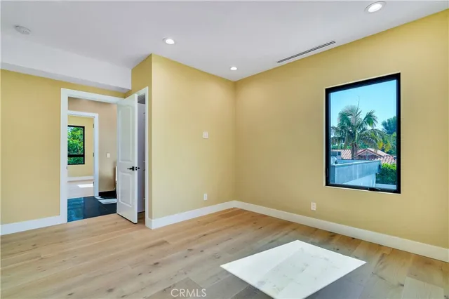 a living room with furniture a fireplace and a potted plant