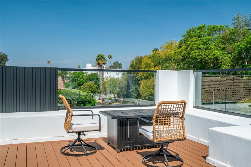 13838 Milbank Street Sherman Oaks, CA 91423 - Photo 43 of 57 a view of balcony with wooden floor and outdoor seating