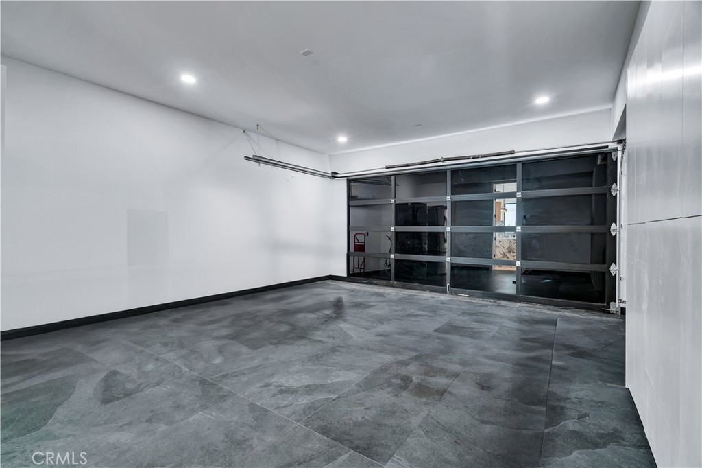 13838 Milbank Street Sherman Oaks, CA 91423 - Photo 52 of 57 a view of an empty room with a closet and a window