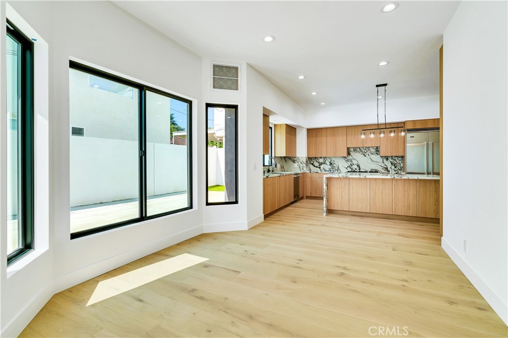 13838 Milbank Street Sherman Oaks, CA 91423 - Photo 10 of 57 a view of a kitchen with a sink and a large window