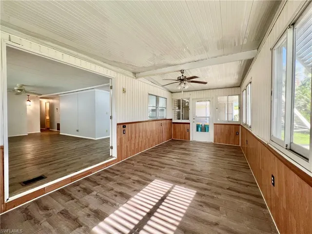 a view of a living room with a large window