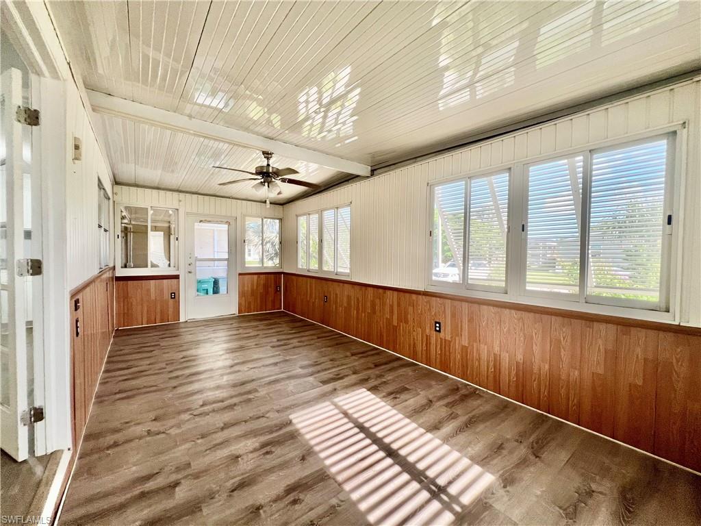 13 Cannes Drive Naples, FL 34112 - Photo 21 of 50 a view of entryway with wooden floor