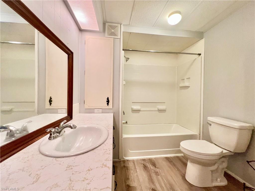 13 Cannes Drive Naples, FL 34112 - Photo 26 of 50 a bathroom with a sink toilet and shower