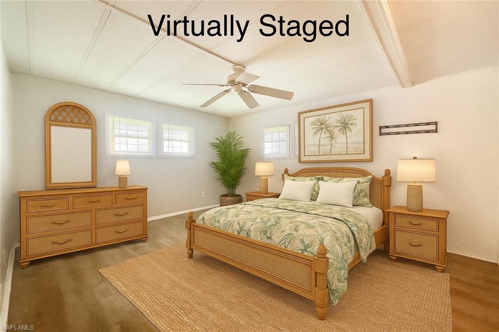 13 Cannes Drive Naples, FL 34112 - Photo 27 of 50 a bedroom with a bed and a dresser