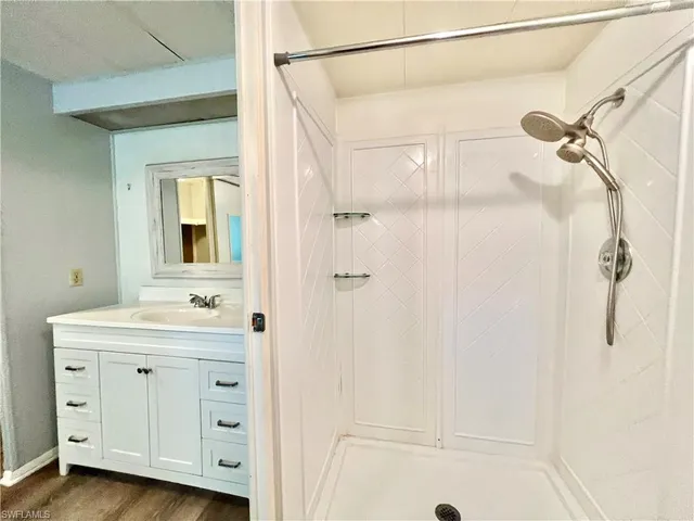 a bathroom with a sink and a mirror