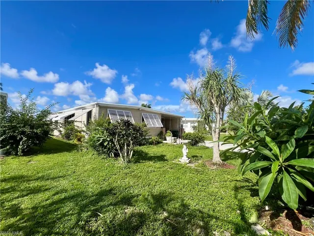 a backyard of a house with lots of green space
