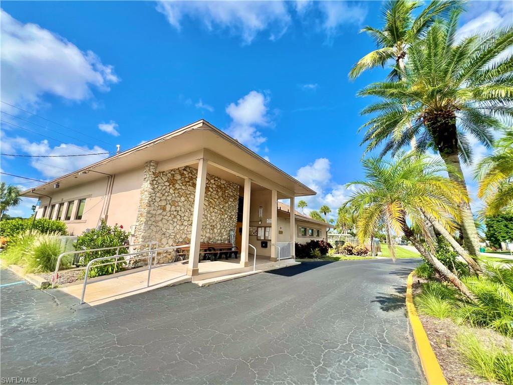 13 Cannes Drive Naples, FL 34112 - Photo 42 of 50 a view of a building with a street