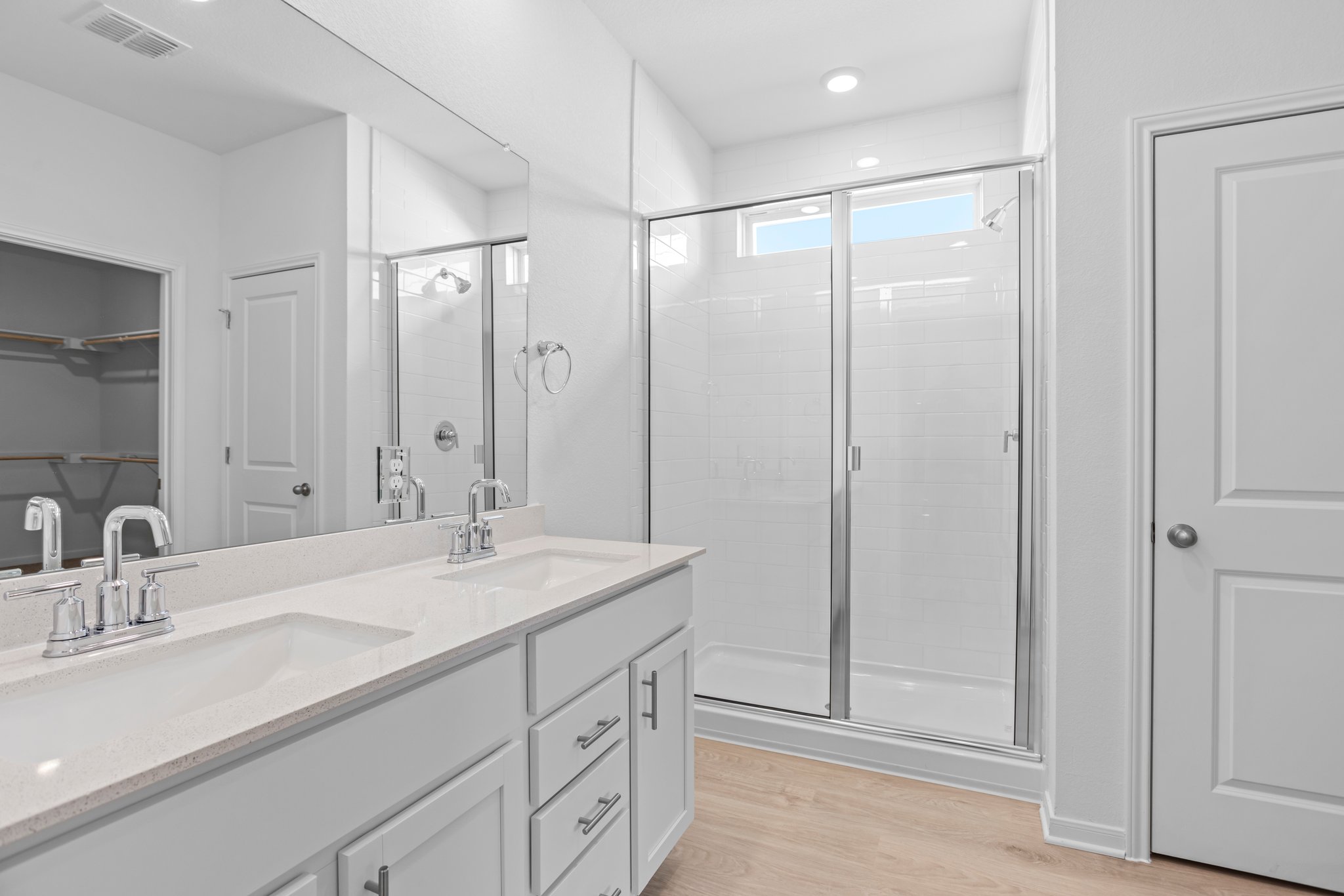 305 Brooks Ranch Drive Kyle, TX 78640 - Photo 23 of 32 a bathroom with a shower sink vanity and mirror